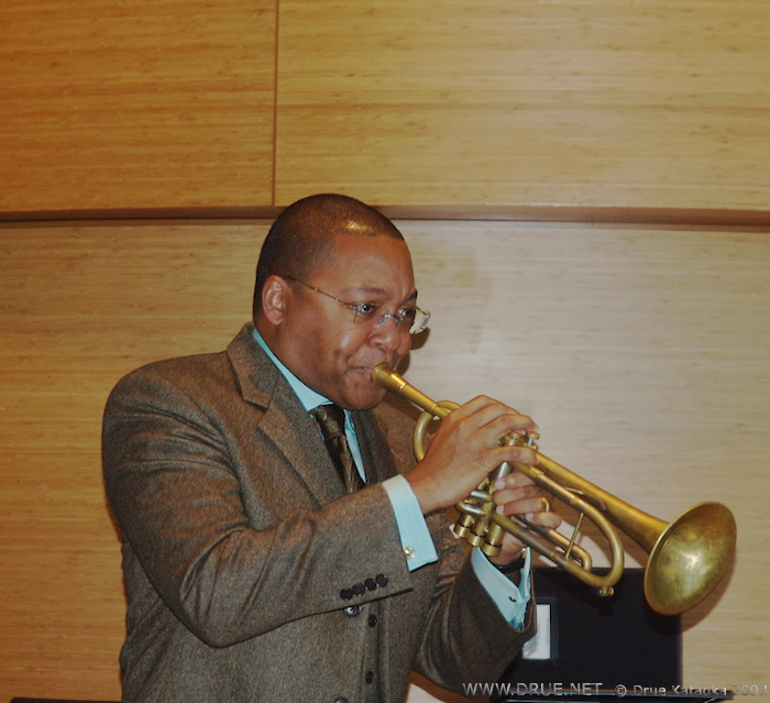 Wynton encircles Drue's Enso with the bell of his horn