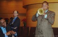 Wynton turns toward the audience with his trumpet